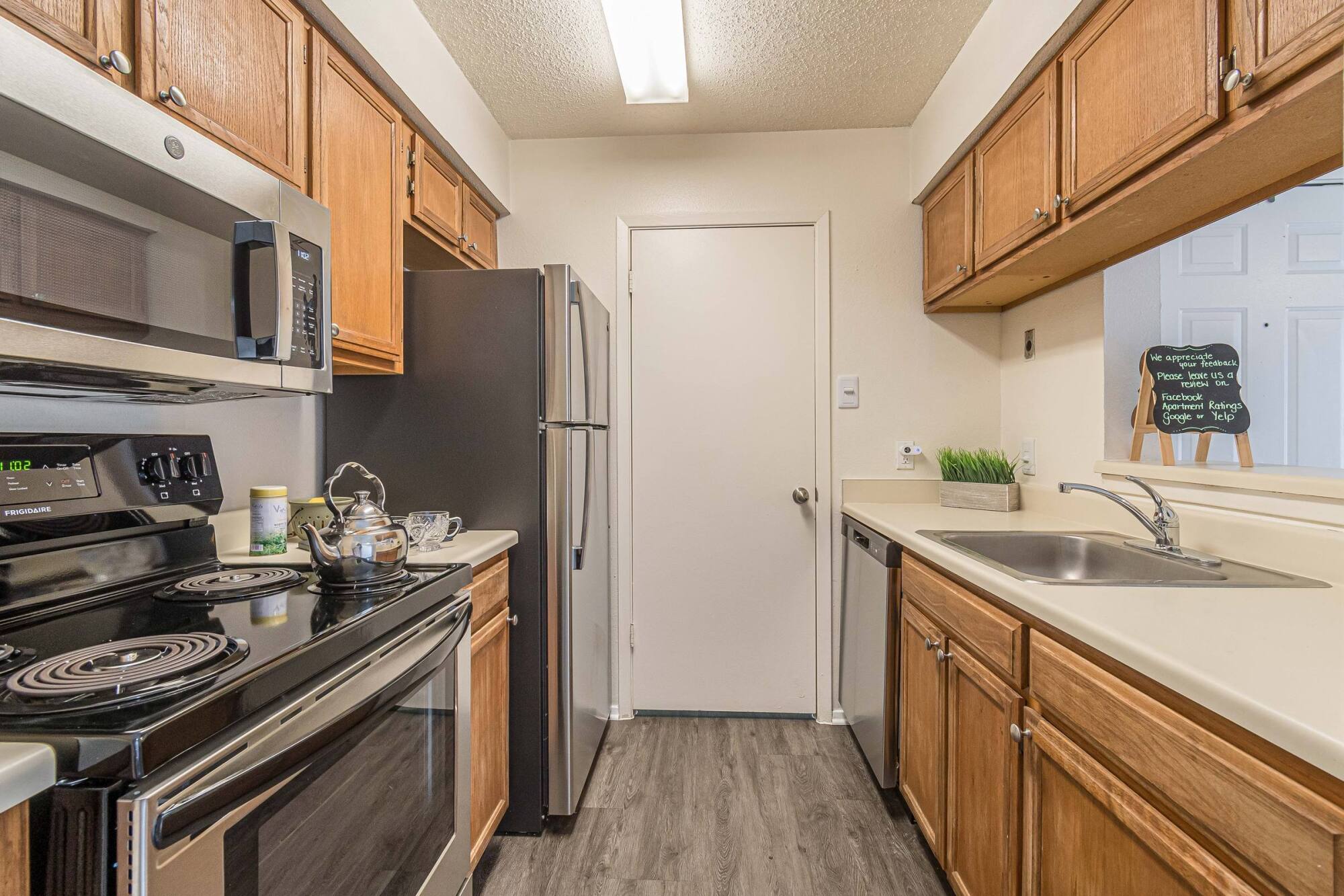 Keystone Apartments galley kitchen with stainless steel appliances in Killeen TX